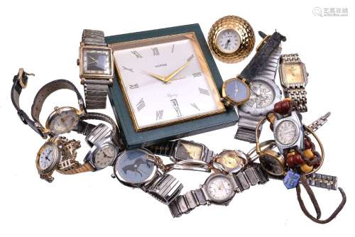 A collection of wristwatches and two clocks