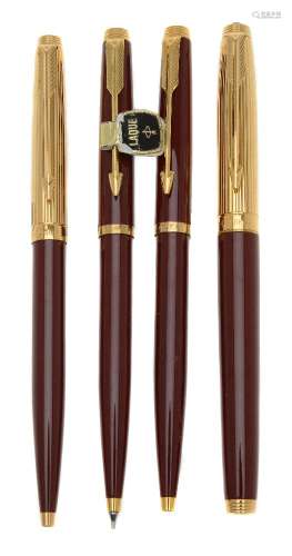 Parker, 75 Custom, a burgundy laque fountain pen, two ballpoint pens and a propelling pencil