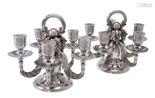 Georg Jensen, a pair of Danish silver Grape pattern candelabra