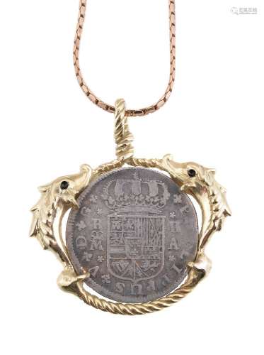 A Spanish coin pendant