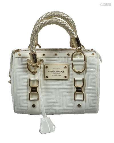 Gianni Versace, a white patent leather handbag