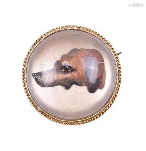 An early 20th century reverse painted crystal intaglio of a hound