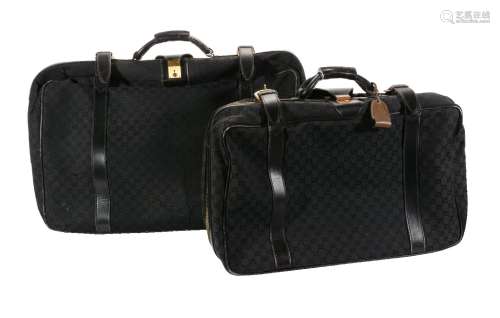 Gucci, a black monogrammed canvas suitcase