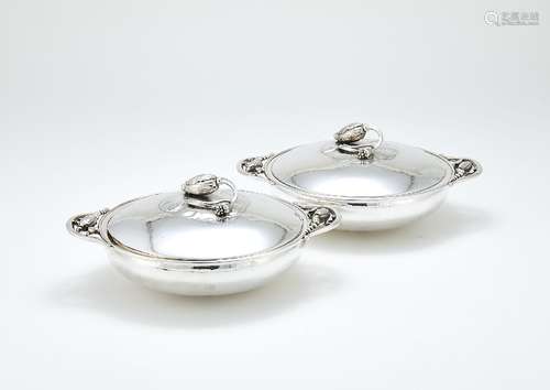 Georg Jensen, a pair of Danish silver Blossom pattern circular vegetable dishes