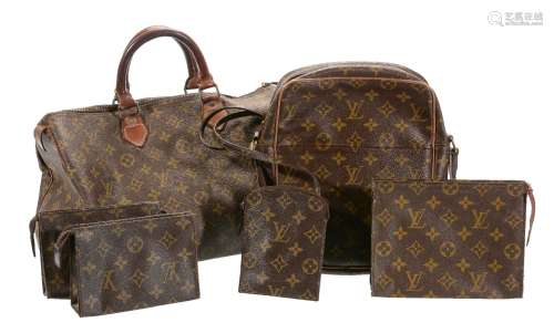 A collection of Louis Vuitton travel bags