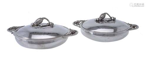 Georg Jensen, a pair of Danish silver Blossom pattern circular vegetable dishes