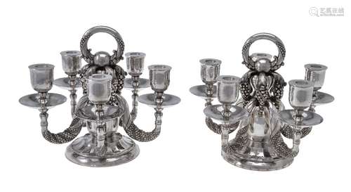 Georg Jensen, a pair of Danish silver Grape pattern candelabra