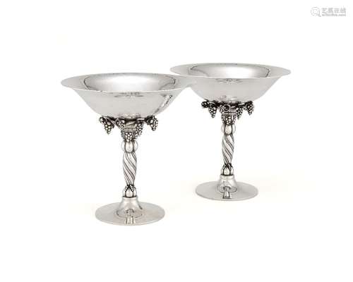 Georg Jensen, a pair of Danish silver Grape pattern pedestal bowls