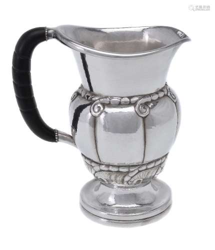 ϒ Georg Jensen, a Danish silver water jug or pitcher