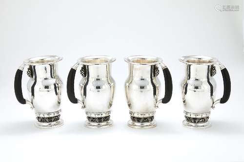 ϒ Georg Jensen, a Danish silver Grape pattern pitcher or jug