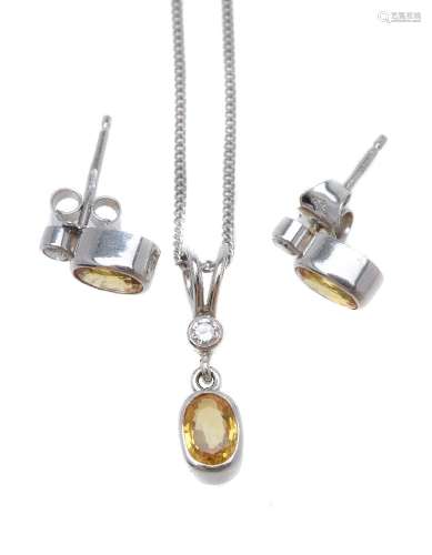 A diamond and yellow sapphire pendant and ear studs