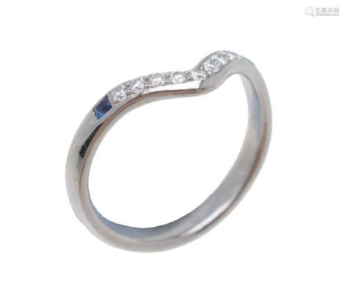 A diamond and sapphire wishbone ring