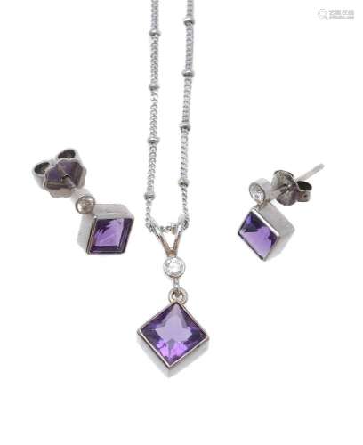 An amethyst and diamond pendant and ear studs