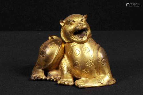 A GILT-BRONZE PAPER WEIGHT