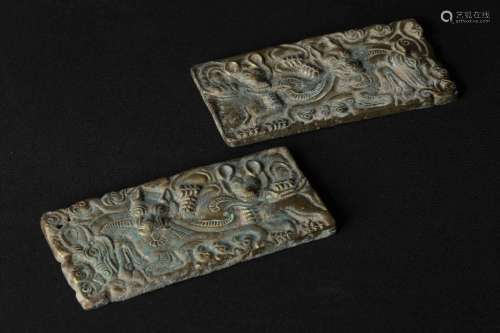 A PAIR OF GILT-BRONZE CARVED PLAQUES