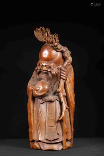 A BAMBOO CARVING OF LIFE GOD