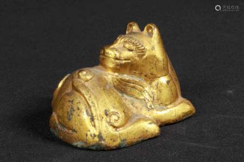 A GILT-BRONZE ORNAMENT