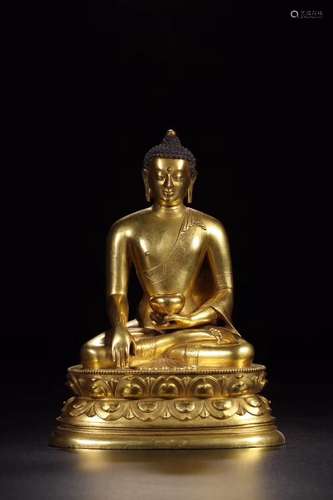 A GILT-BRONZE FIGURE OF SHAKYAMUNI