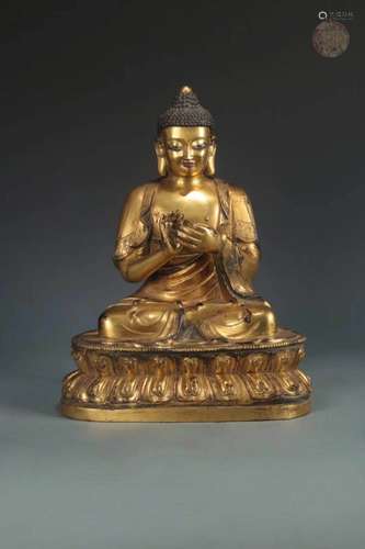 A GILT-BRONZE FIGURE OF SHAKYAMUNI