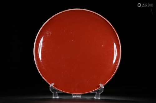 A RED GLAZED PLATE