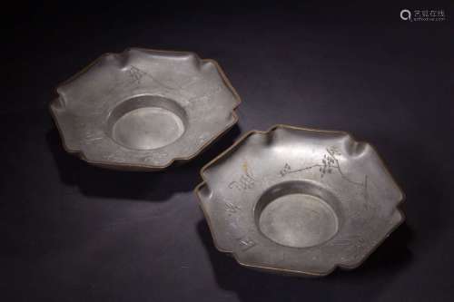 A PAIR OF TIN TEA CUP HOLDERS