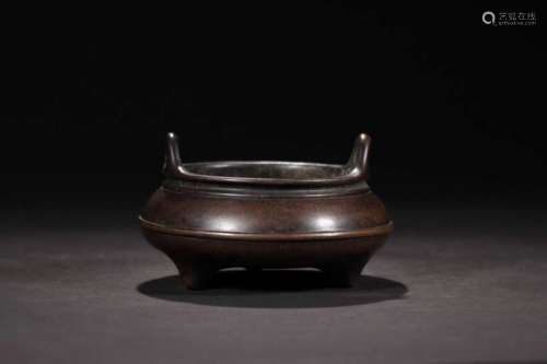 A BRONZE TRIPOD CENSER