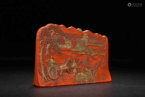 A RED CARVED PLAQUE