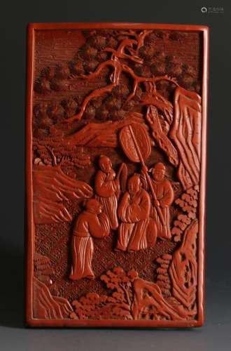 A RED LACQURE FIGURAL  PLAQUE