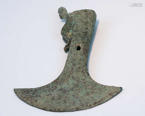 A BRONZE MOLDED AX SHAPED PENDANT