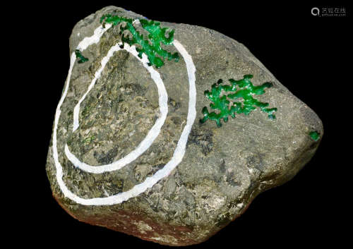 A BURMESE GREEN JADEITE STONE, A CLASS