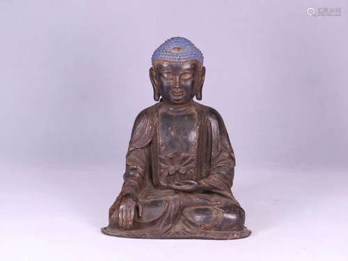 A GILT BRONZE CARVED BUDDHA