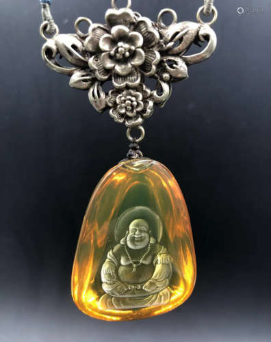 A MEXICAN BLUE AMBER PENDANT