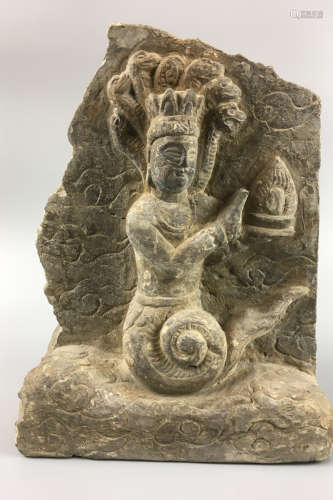 A STONE CARVED FIGURE PENDANT