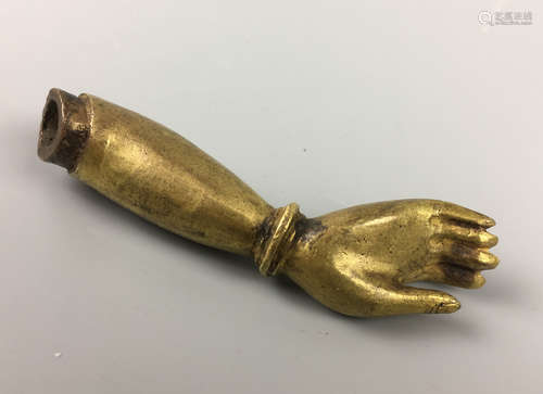 A GILT COPPER BUDDHA HAND PENDANT