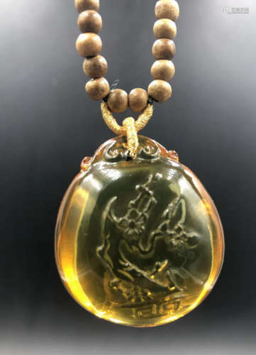 A MEXICAN BLUE AMBER PENDANT