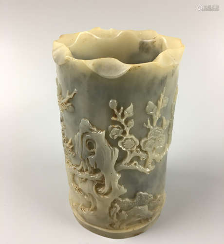 A CELADON JADE CARVED FLORAL BRUSH POT