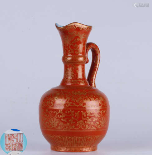 A IRON-RED-GROUND GILT FLORAL PATTERN VASE