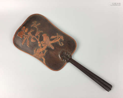 A RED WOOD FLORAL AND BIRD PATTERN FAN