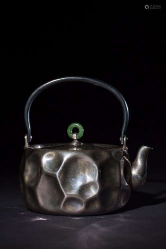 AN OLD LIFTING-HANDLE SILVER TEAPOT