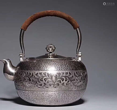 A HERB PATTERN LIFTING-HANDLE SILVER TEAPOT