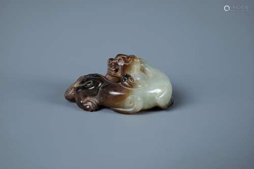 A  CARVED CHINESE WHITE AND RUSSET JADE PENDENT