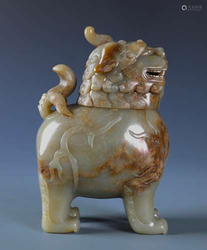 A RARE AND FINELY CARVED  CHINESE JADE LION-SHAPED