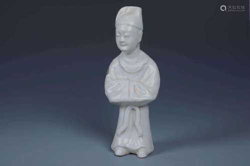 A CHINESE WHITE GLAZED FIGURE