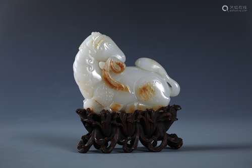 A CARVED CHINESE WHITE AND RUSSET JADE  AND ZITAN STAND