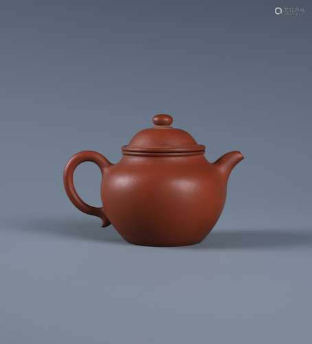 A SMALL YIXING ZISHA TEAPOT AND COVER