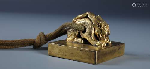 A CHINESE GILT BRONZE SEAL WITH CHILONG HANDLE