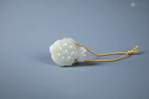 A Finely Carved White Jade Lotus Ornament