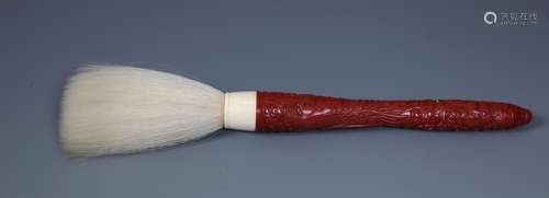 A FINE CHINESE CINNABAR LACQUER DRAGON BRUSH