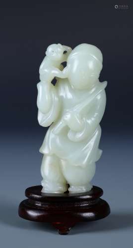 A CHINESE BOY AND MONKEY JADE CARVING