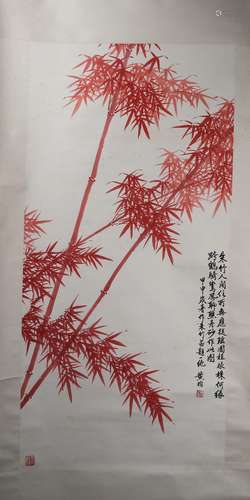 A CHINESE PAINTING OF RED BAMBOO SIGNED BY HUANG JUN